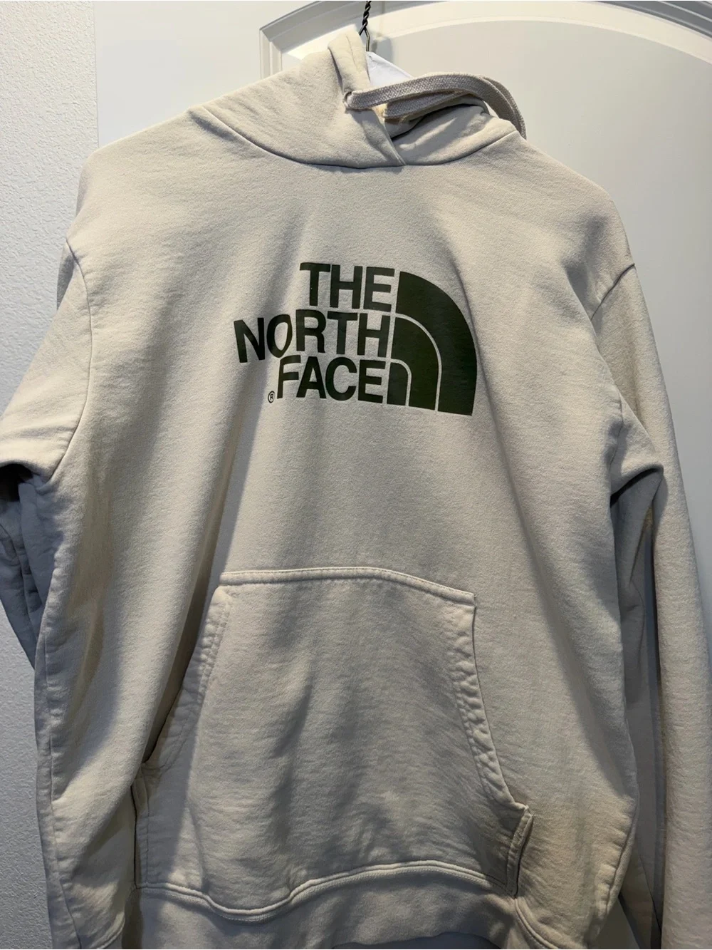 The North Face Light Beige Hoodie with Dark Green Logo